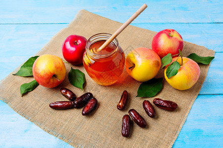 果冻纸巾上的玻璃蜂蜜罐日期和苹果冻新年符号roshan概念有机水果玻璃蜂蜜罐日期和苹果图片