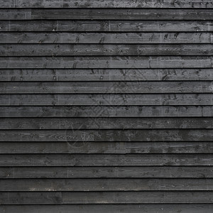 黑漆的谷仓墙或棚木板黑漆的谷仓墙或棚木板的平方部分图片