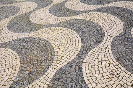 典型的葡萄牙可塑石手造人行道的详情利斯顿脚下图片