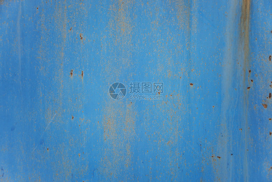 蓝色抽象背景生锈金属表面含蓝色涂料粉片和裂缝纹理图片
