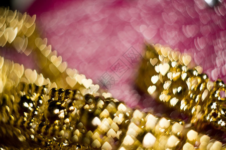 粉色和金的彩模糊背景bokeh效应图片