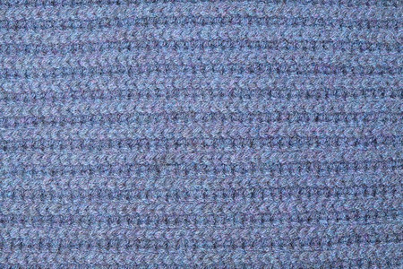 蓝羊毛编织布的纹理以背景为形态图片