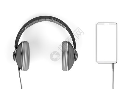 白显示器顶视图的大型有线耳机和智能手图片