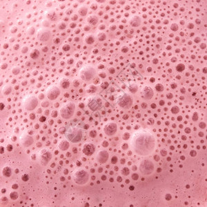 果汁牛奶颈部的宏观照片有很多泡食物布局顶部视图果汁健康粉红色冰淇淋与泡的宏观照片食物背景提示视图图片