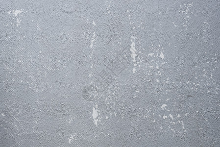在水泥墙上涂旧灰色的抽象背景有刮痕和困苦纹理倒影和古老背景图片