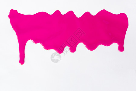 粉色涂料在白背景上滴图片