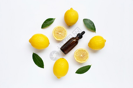 新鲜柠檬基本油白色背景图片