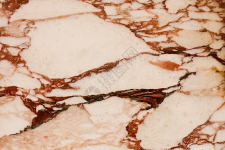 象牙棕色块大理石瓷砖带裂缝的纹理背景图片