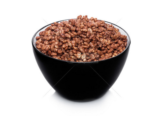 黑色碗白上带有天然机粮粉颗粒谷物巧克力片图片