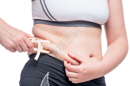 胖女人用腹部工具测量脂肪水平图片