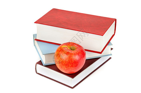 书本和红苹果孤立在白色背景学校销售图片