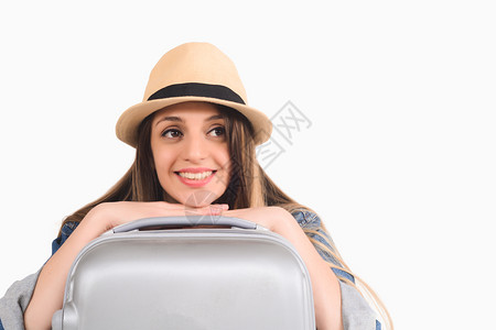 年轻旅游妇女用手提箱的肖像旅行概念图片