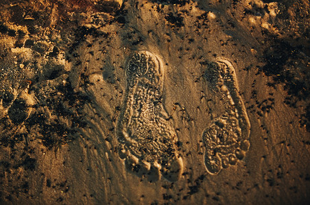 沙地背景纹理上的脚印夏天图片