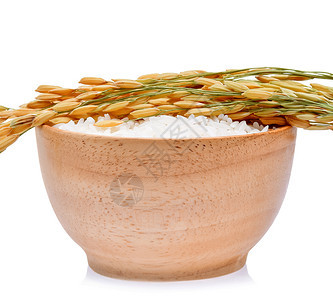 白底木碗中的水稻白底黑茉米饭谷物图片