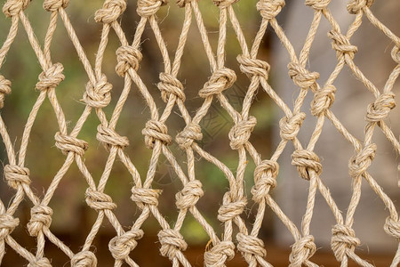 传统渔网上的结的特写镜头由绳子打结而成渔网新结绳线的抽象设计图片