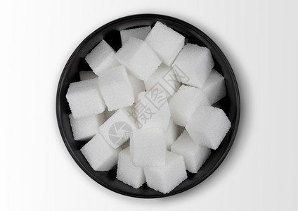 白色上的黑碗天然白糖块图片