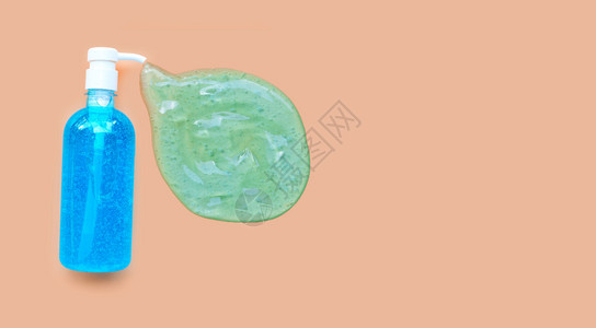 泵瓶内洗净剂凝胶奶油彩色背景复制空间手卫生冠状保护概念图片