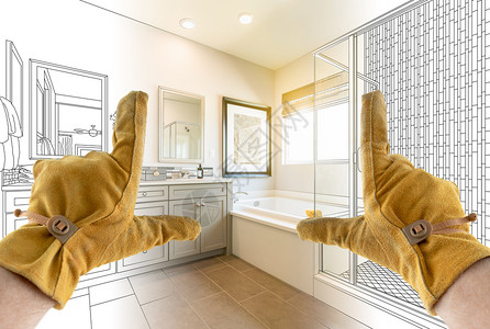 男订约人手铺设浴室的完整部分与浴室的绘图图片