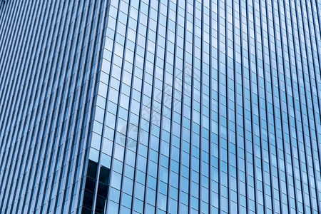 阳光明媚的现代高楼蓝眼镜窗口的抽象背景图片