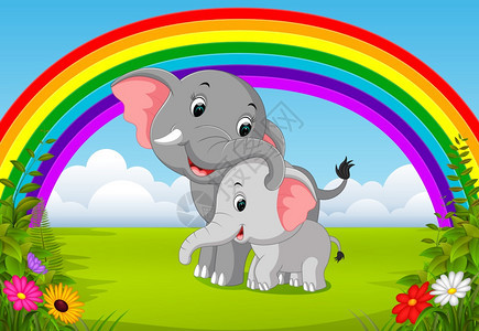 大象和宝宝在丛林中与彩虹景象图片