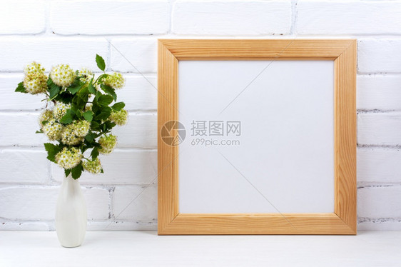 在花瓶中用白色spirea分支模拟木制方形图框用于演示文稿设计的空框现代艺术的模板框架图片