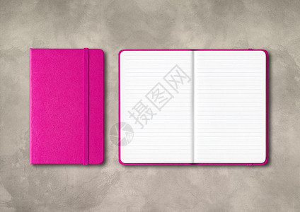 粉红色关闭和打开的笔记本在混凝土背景上与世隔绝粉红色封闭和打开的笔记本在混凝土背景上与世隔绝图片