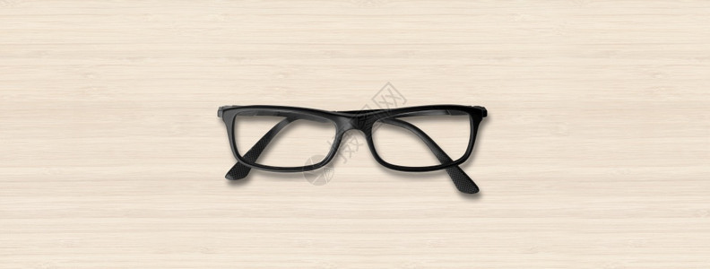 白色木头背景横幅上隔离的黑眼镜白色木头横幅上隔离的黑眼镜图片