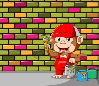 猴子拿着一桶疼痛和刷子来涂墙壁砖头的颜色图片
