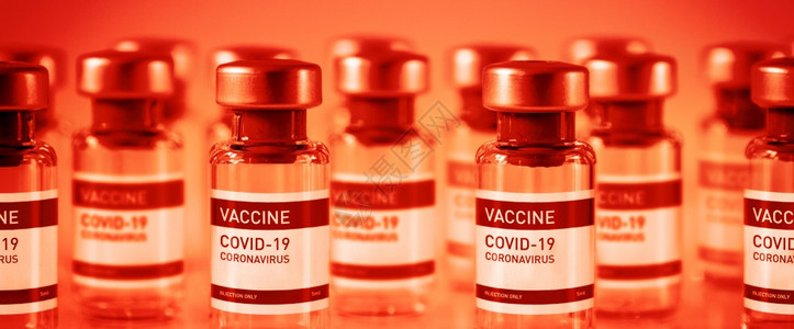 红色实验室背景的19个疫苗瓶横向幅红色背景的19个疫苗瓶图片