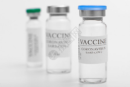 疫苗选择实验室内带有共生19种疫苗的薄膜与冠状沙拉cov2大流行作斗争玻璃瓶医疗特效隔离在白色背景玻璃瓶医疗特效隔离在白色背景图片