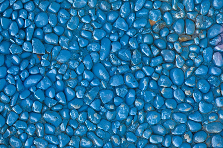 蓝色墙由小石头制成图片