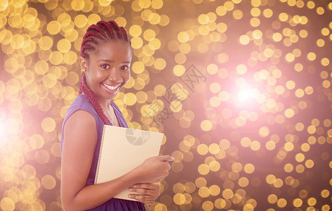 以灯光作为背景的非洲年轻快乐女学生图片