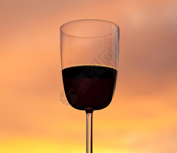 以一杯红酒来放松与辉煌的日落亮橙色对抗图片