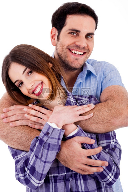 一个可爱的年轻男人从后面拥抱妻子的近身肖像图片