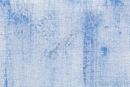 白色艺术家画布上涂漆的浅蓝色粗纹理图片