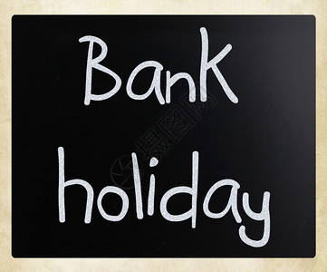 银行假日手写白色粉笔在黑板上图片