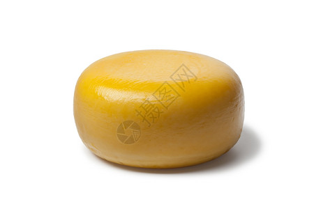 白色背景的全黄荷兰古达奶酪图片