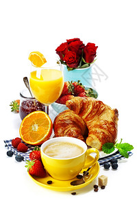 早餐牛角面包咖啡和橙汁图片