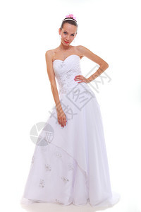 穿着白色礼服的全长年轻有吸引力的浪漫新娘白衣与背景隔绝图片