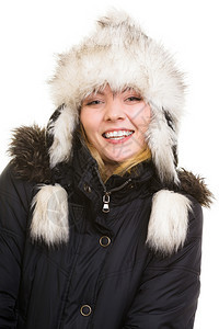 冬假穿着温暖衣服的快乐正女孩穿着毛帽的快乐年轻女人图片