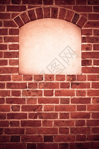 砖墙背景中带有文字框架空间的旧石块拱弧角位置图片