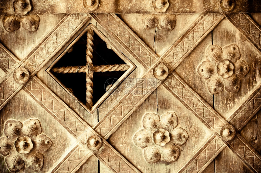 建筑细节装饰的旧木门一部分花岗装饰作为背景纹理或图案图片