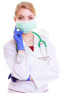 戴面罩和白大衣的妇女带听诊器的医生或护士被隔离医疗保险的务人员图片