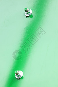 工业机械绿色金属背景细节的螺和栓图片