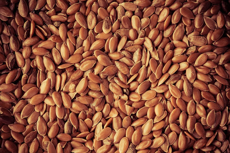 棕色原麻叶种子作为天然食物背景图片