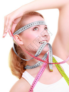 饮食减瘦体重时间保健康生活方式身妇女配有丰富多彩的测量磁带痴迷女孩的身体图片