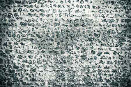 背景或纹理模式风格的灰色设计装饰有水泥的不均匀石墙壁表面图片
