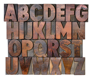 用彩色墨水染的文字印刷木型块的英文字母图片