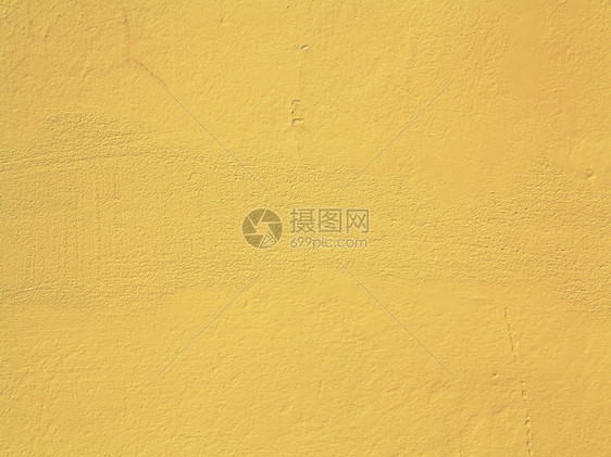 黄色橙油漆混凝土壁背景或纹理图片