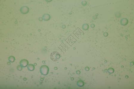绿色灰抽象模糊液体背景带有肥皂泡沫图片
